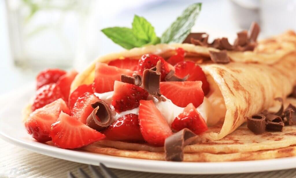 Crepes with curd cheese and strawberries